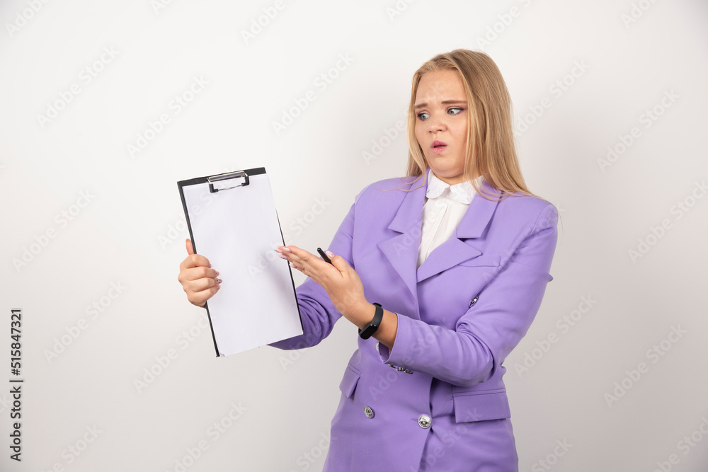 Young woman with pencil showing tablet on white background Young woman with pencil showing tablet on white background