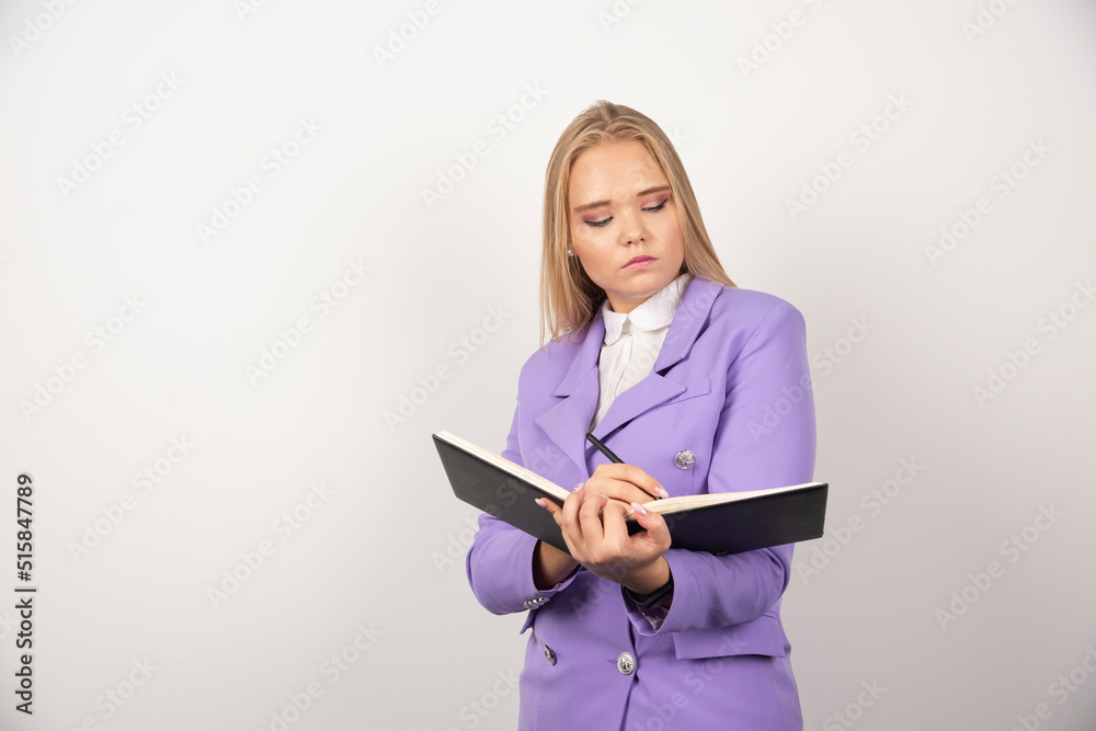 Young woman with opened tablet on white background Young woman with opened tablet on white background