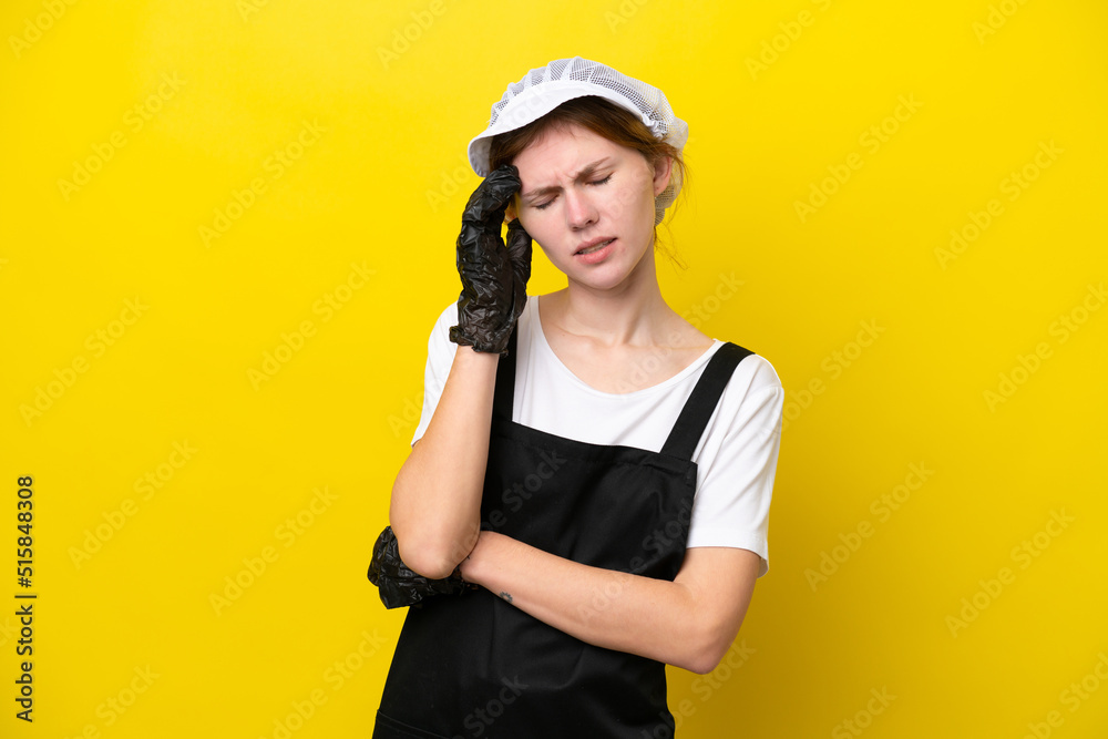 Young English fisherwoman isolated on yellow background with headache