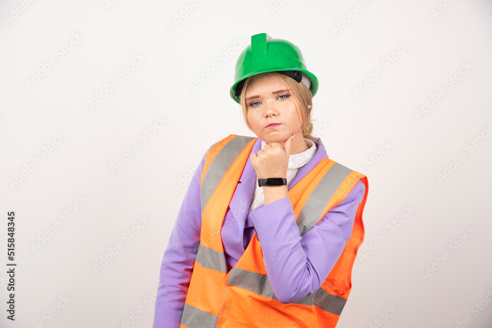 Woman builder in helmet on white background Woman builder in helmet on white background