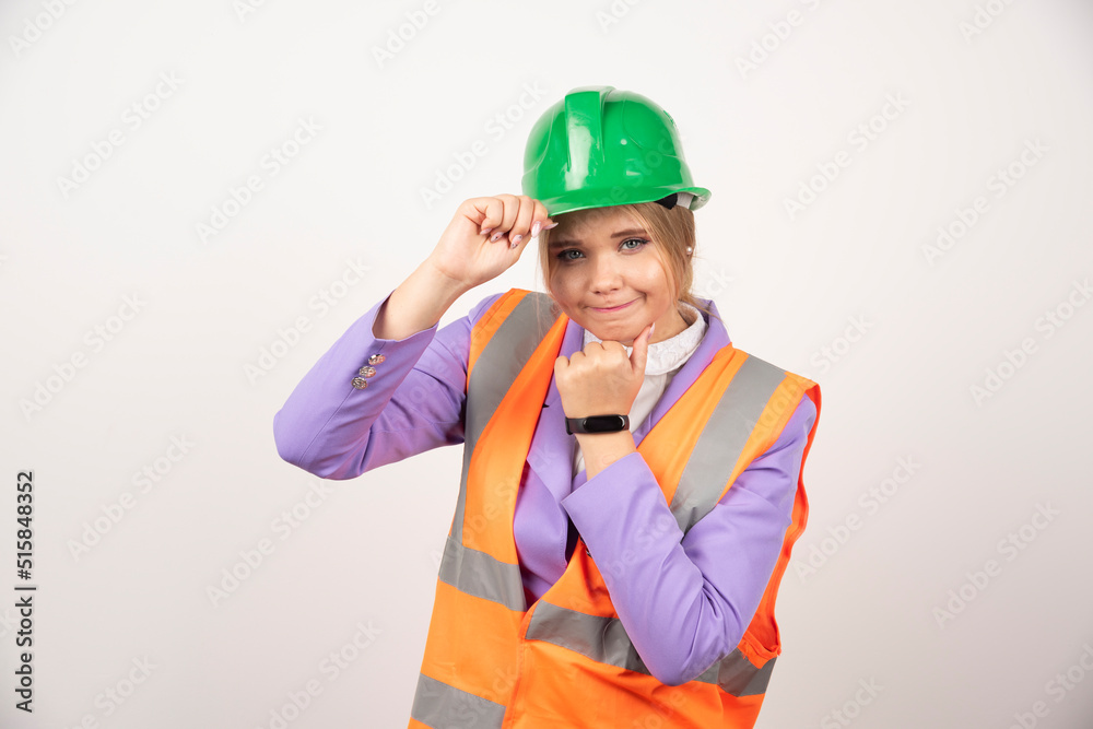 Woman builder in helmet on white background Woman builder in helmet on white background
