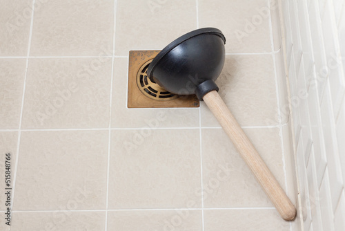Fotografia Rubber plunger on shower floor
