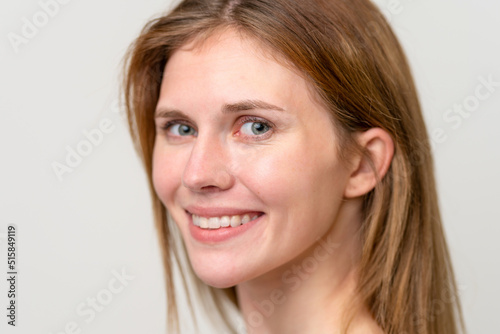 Portrait of pretty young woman over isolated white background