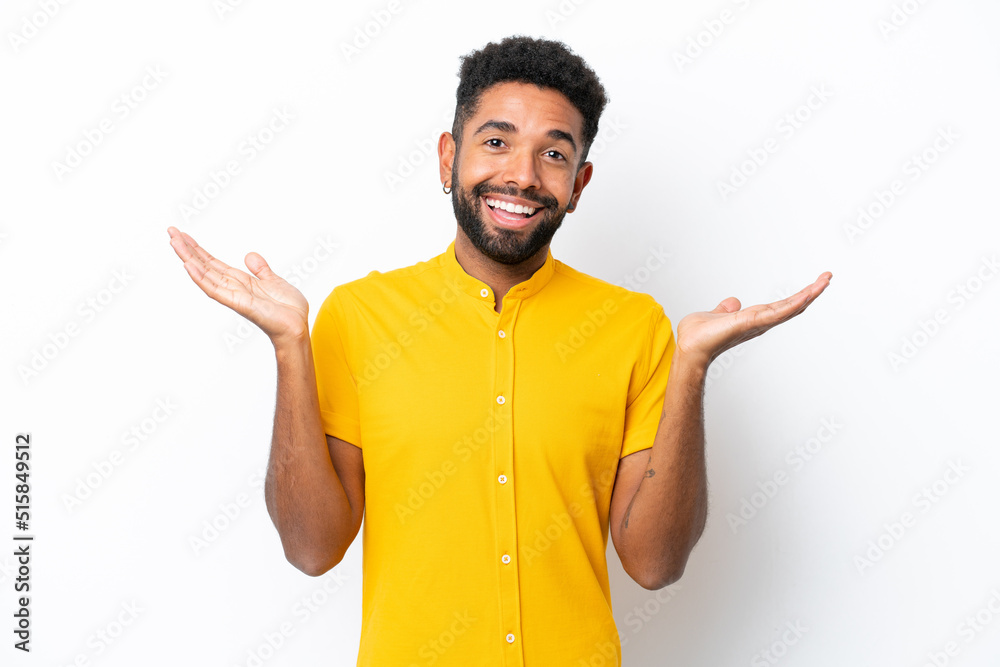 Young Brazilian man isolated on white background with shocked facial expression Young Brazilian man isolated on white background with shocked facial expression