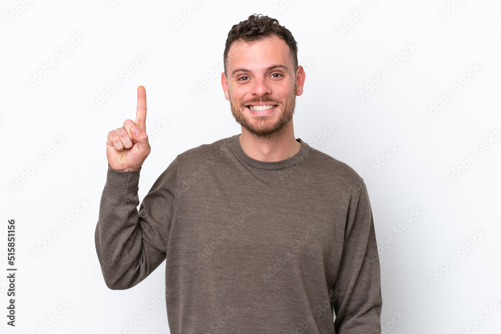 Young Brazilian man isolated on white background pointing up a great idea Young Brazilian man isolated on white background pointing up a great idea