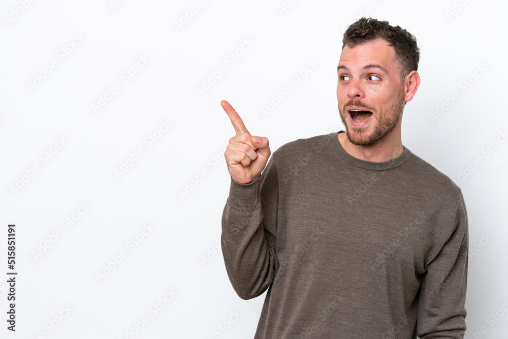 Young Brazilian man isolated on white background intending to realizes the solution while lifting a finger up Young Brazilian man isolated on white background intending to realizes the solution while lifting a finger up