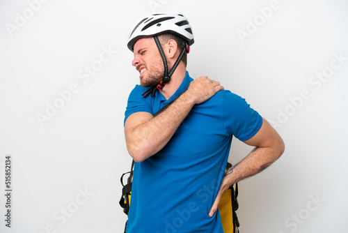 Young brazilian man with thermal backpack isolated on white background suffering from pain in shoulder for having made an effort