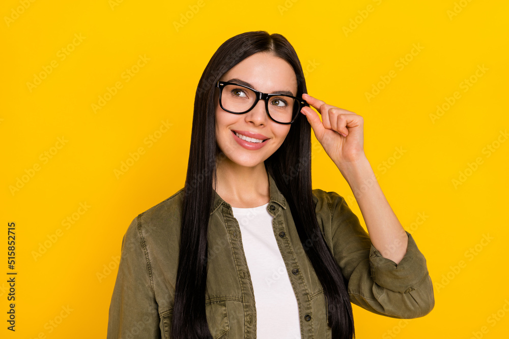 Photo of sweet millennial lady look promo wear spectacles khaki outfit isolated on yellow color background