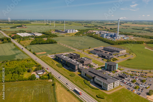 Panoramic aerial view of industrial park and bioenergy plant. Concept of sustainable production of biogas. Concept of biomass heat and power. Renewable and low carbon energies production. photo
