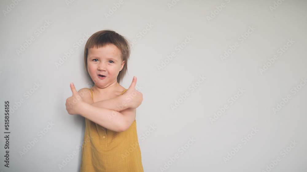 Funny child shows hand like, hand thumb up Funny child shows hand like, hand thumb up