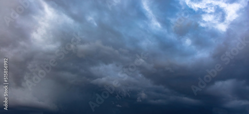 Cloud on blue sky background. White and grey color cloudscape, gloomy weather