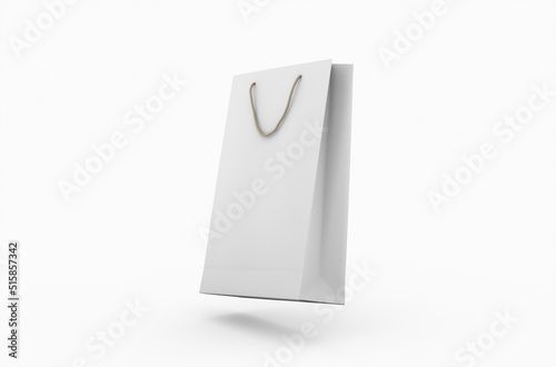 Eco-friendly white paper shopping bag with string handle isolated on white background