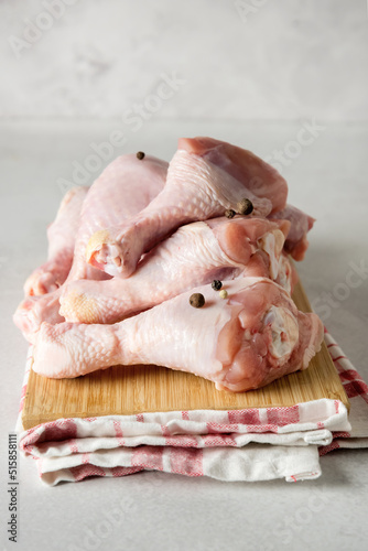 Raw Chicken Legs on Wooden Tray Napkin Vertical