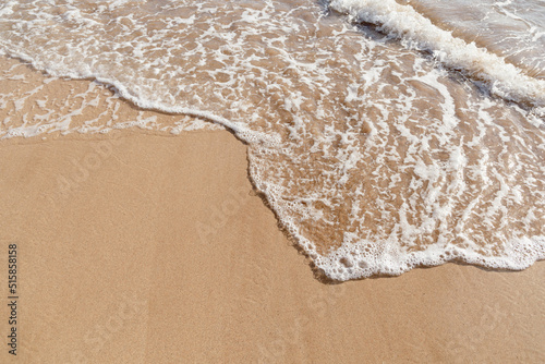Fototapeta Naklejka Na Ścianę i Meble -  Maui Hawaii beach coastline of sand, sun, and blue water with crashing