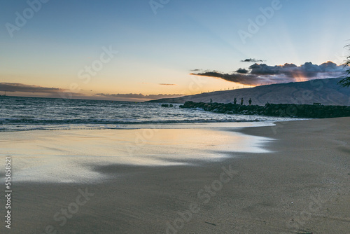 Maui Hawaii beach coastline of sand  sun  and blue water with crashing