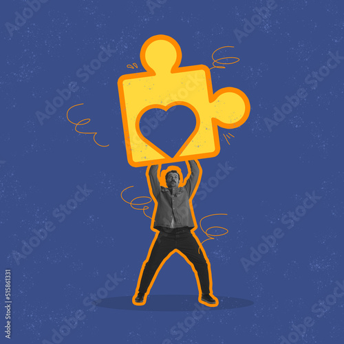 One man in retro style clothes raising up big drawn piece of puzzle isolated over blue background. Concept of self-knowledge, love, hope concept.