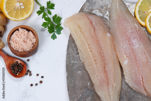 Fresh Pangasius dory Fish Fillet with ingredient on white background