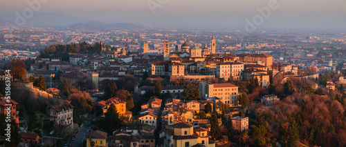 Panoramic view of the upper town of Bergamo with its historic center and medieval monuments, at sunset - February 2022