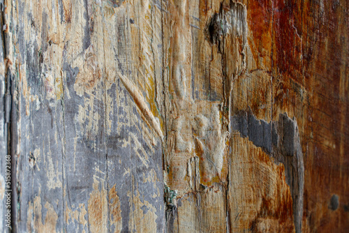 Texture of old wooden boards with cracked paint. Background with old wooden boards.