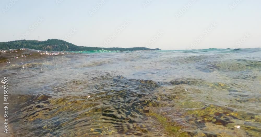View of sea wave from water levels, beautiful seascape, horizon, clear blue sky, underwater scene, summer marine holidays vision. View of sea wave from water levels, beautiful seascape, horizon, clear blue sky, underwater scene, summer marine holidays vision.