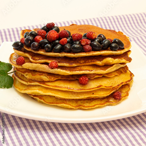 pancakes, pancakes with berries on a colored background