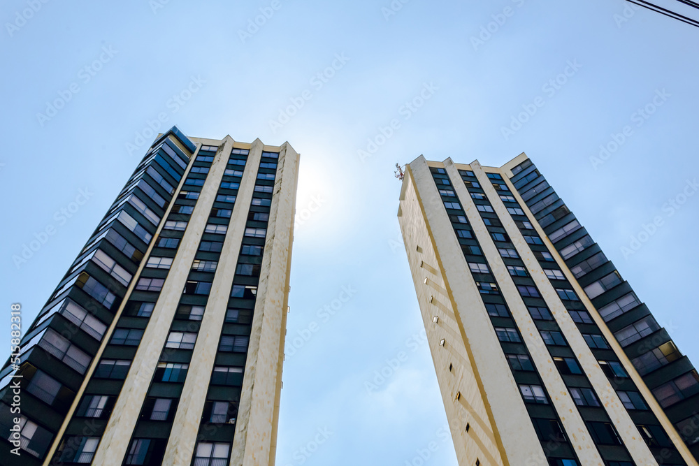 business skyscrapers, business buildings in the city of cali with radiant sun, with blue sky business skyscrapers, business buildings in the city of cali with radiant sun, with blue sky