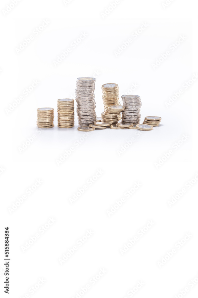abundance of money, columns of one and two euro coins on a white background