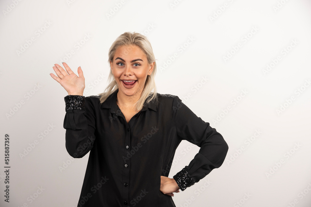 Portrait of positive woman in black shirt posing on white background Portrait of positive woman in black shirt posing on white background