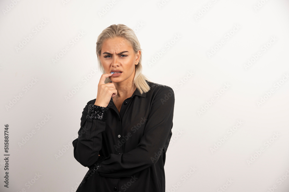 Portrait of stylish woman in black shirt posing on white background Portrait of stylish woman in black shirt posing on white background