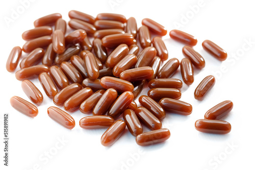 Sunflower lecithin in capsules on a white background. Lecithin in brown capsules close up. alternative medicine, medicinal product