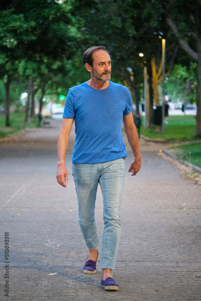 Full-length outdoor portrait of mature adult man. Middle aged man. Full-length outdoor portrait of mature adult man. Middle aged man.
