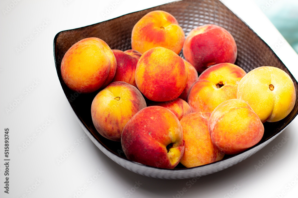 raw peaches in bowl, bowl of fresh peaches on white background raw peaches in bowl, bowl of fresh peaches on white background