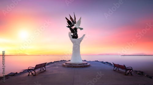 The Hand of Peace sculpture at the seafront in city centre of Kusadasi photo