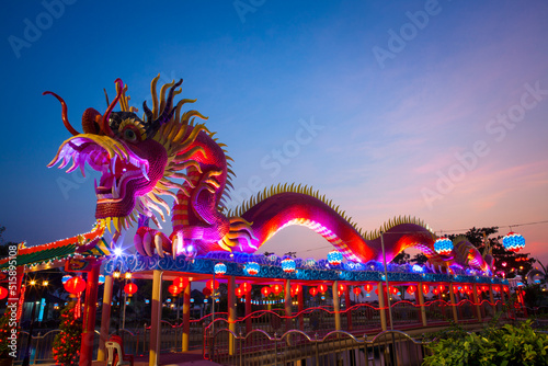 Night view of full color lighting decorate on dragon statue, Chonburi province, Thailand. © sippakorn