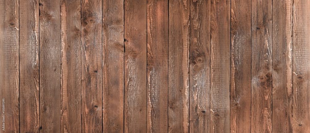 Naklejka premium banner made of dark brown vertical wooden boards. view from above.