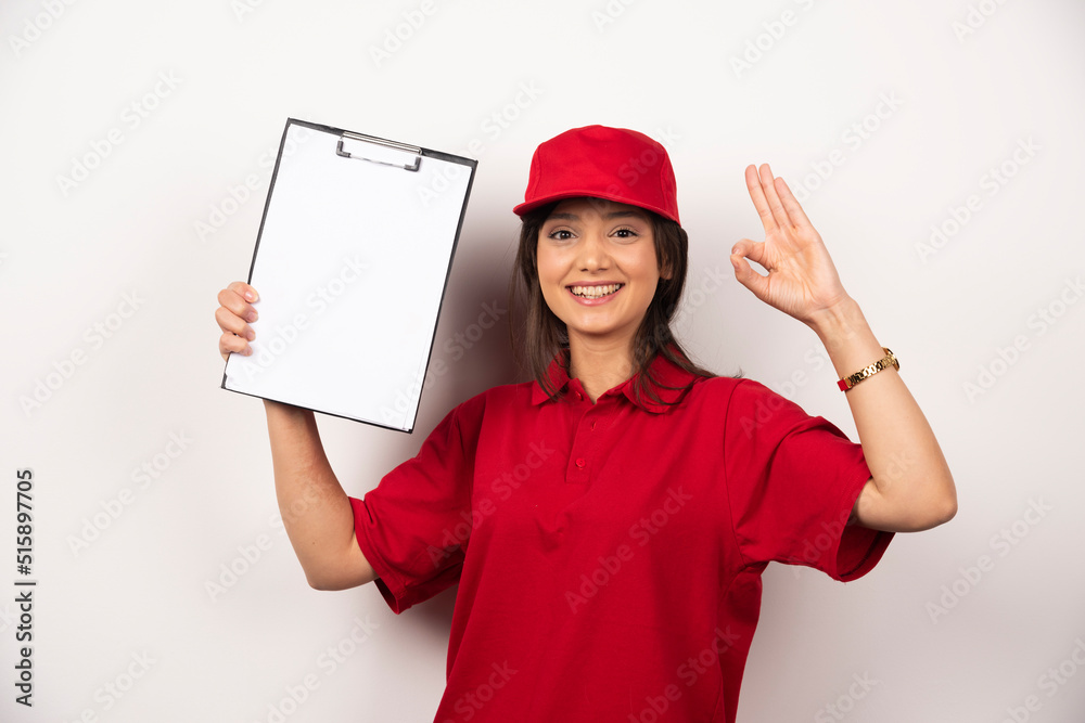 Positive woman in red uniform with empty clipboard Positive woman in red uniform with empty clipboard