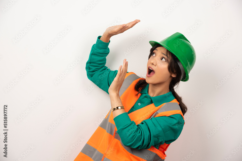 Female industrial engineer in uniform with helmet on white background Female industrial engineer in uniform with helmet on white background