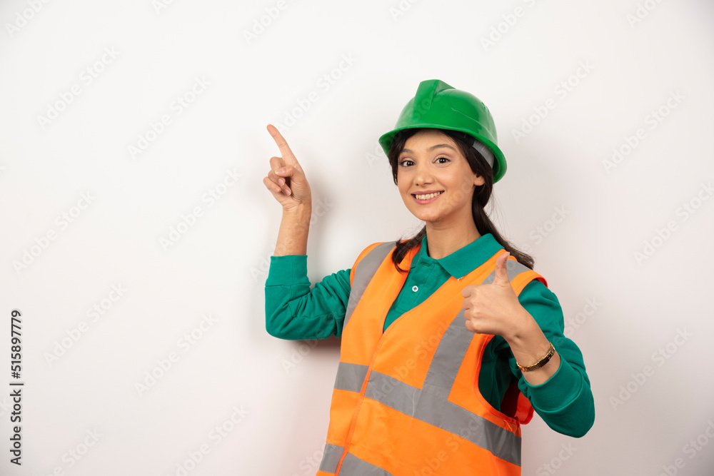 Young female construction worker on white background Young female construction worker on white background