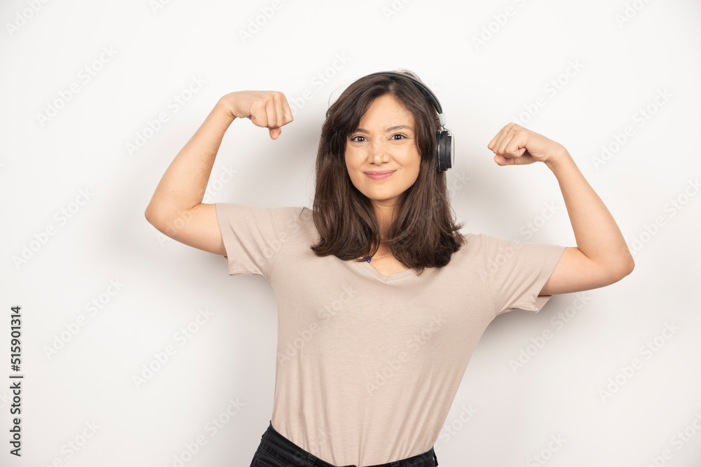 Young woman in headphones on white background Young woman in headphones on white background
