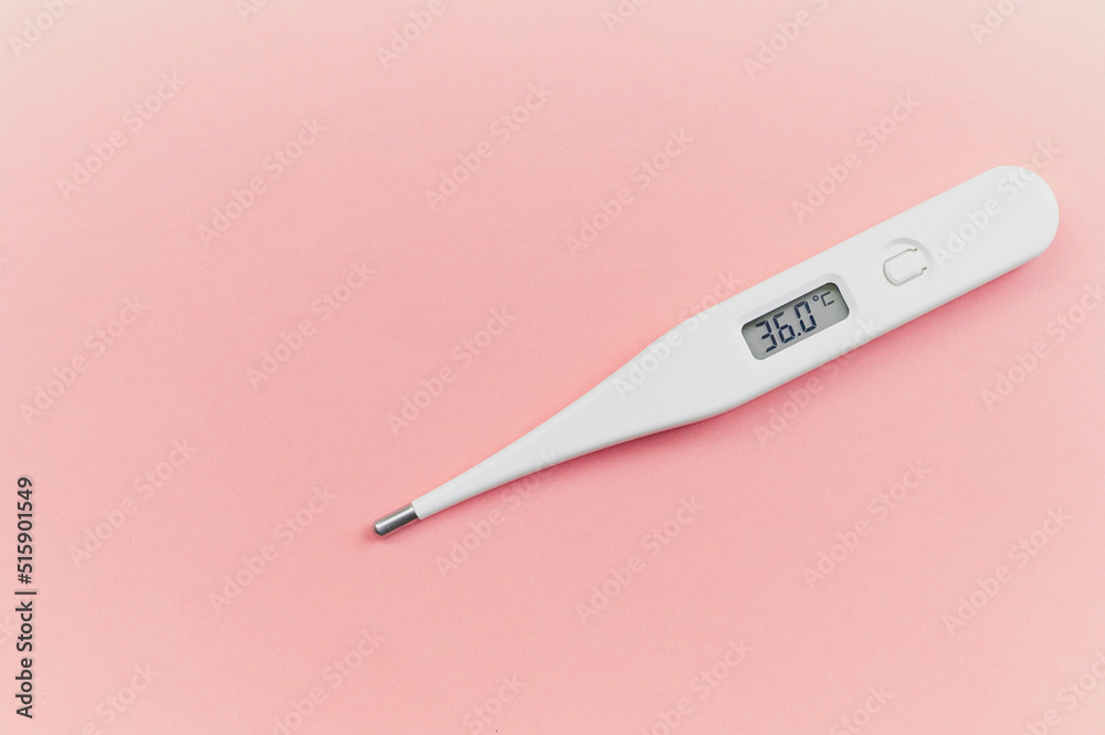 Digital white thermometer with a normal temperature of 36 degrees centigrade on a pink background in the concept of control over health and new emerging viruses for women who are in advanced gestation Digital white thermometer with a normal temperature of 36 degrees centigrade on a pink background in the concept of control over health and new emerging viruses for women who are in advanced gestation
