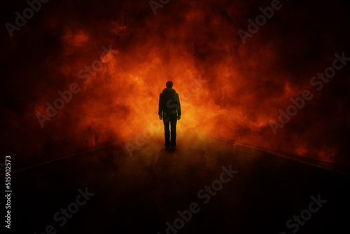 Silhouette of man in abstract dark hot fire flames.