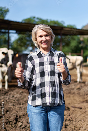 portrait of mature woman at cow farm