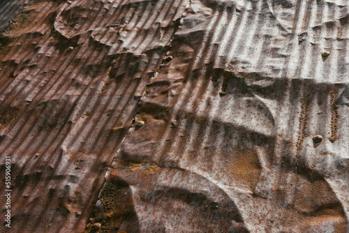 rusty corrugated iron sheets of a roof photo