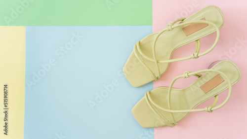 Women's shoes isolated on colorful background. Green modern shoes