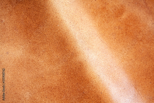 Pele de couro de cor laranja escura, marrom natural com padrão de linhas de design.