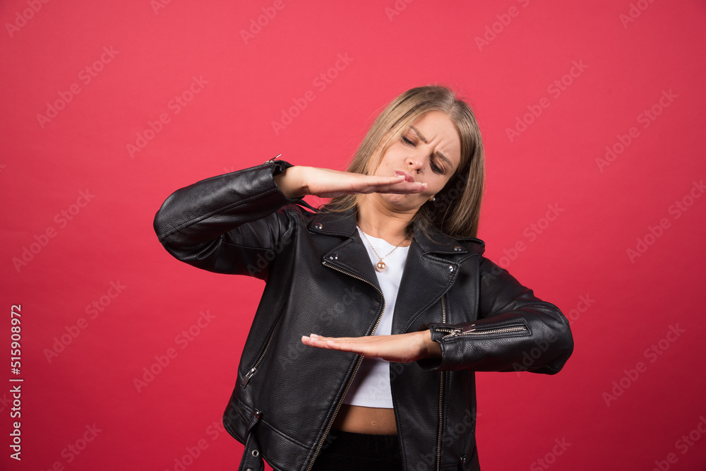 A young female showing something small in size with hands A young female showing something small in size with hands
