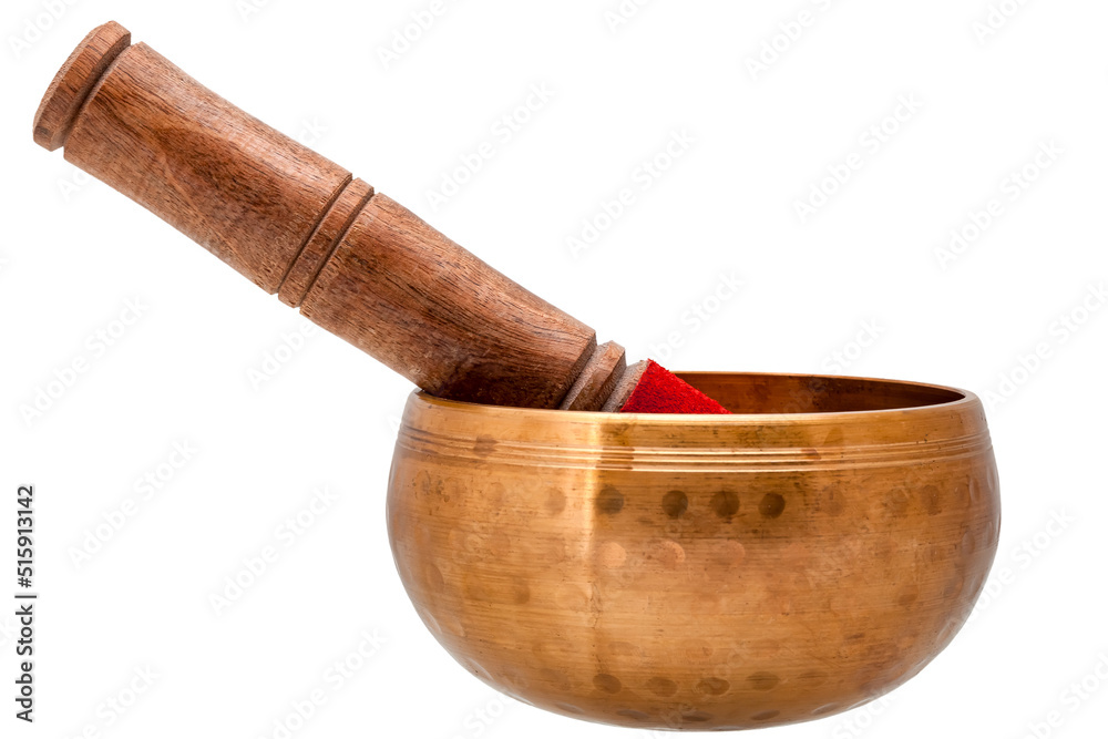 Golden singing bowl from copper and wooden mallet, objects for buddhism yoga isolated on white background side view. Sound healing therapy meditation equipment, nobody.