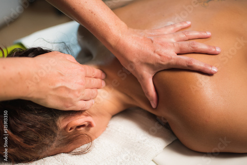 woman receiving a massage of the cervical area
