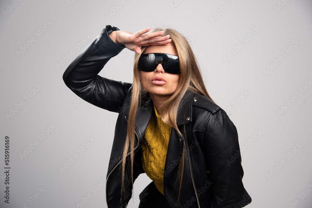 Blonde celebrity in black sunglasses looks confident and proud of herself Blonde celebrity in black sunglasses looks confident and proud of herself