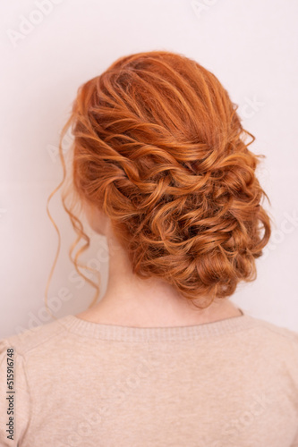  Female back with red hairstyle on hairdressing salon background 